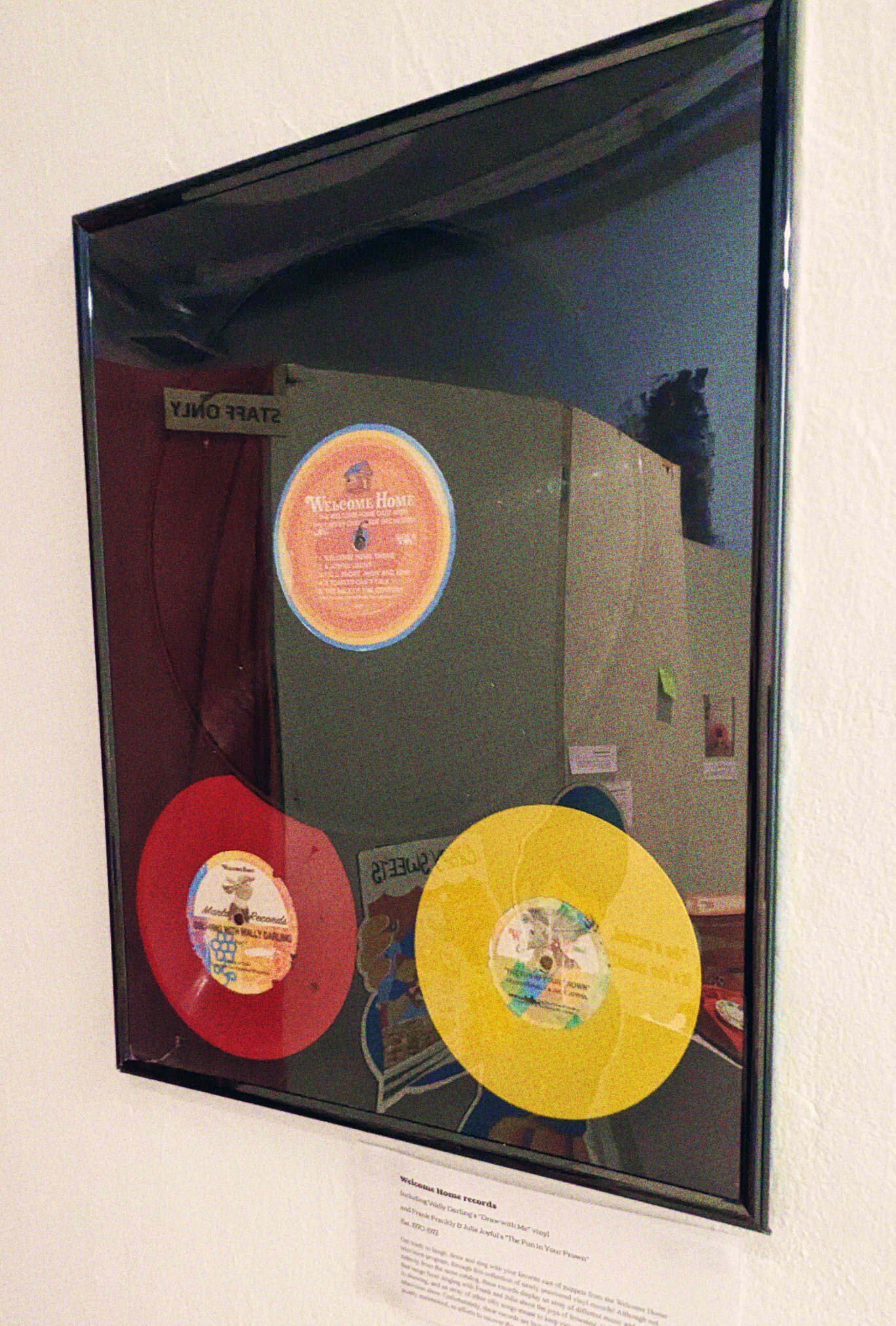 A photograph showing the entire vinyl frame, which houses two more records.